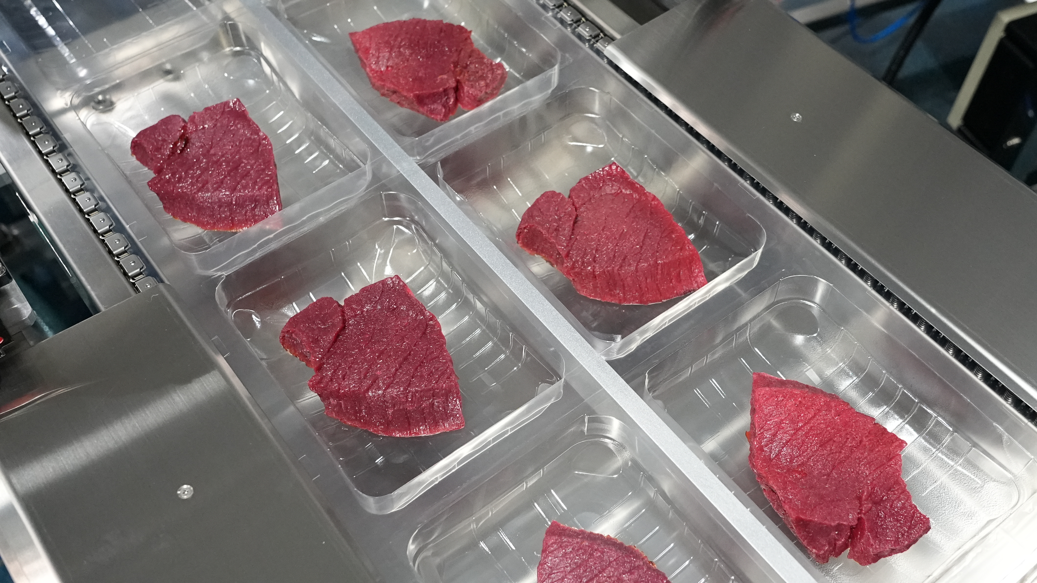 Hualian HVR-420T(Q) Confezionatrice sottovuoto termoformatrice MAP a film rigido per piatti pronti di salmone, frutti di mare, carne